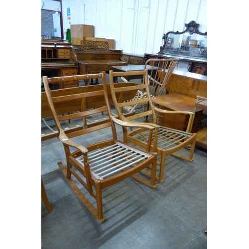 55 - A pair of Parker Knoll teak rocking chairs