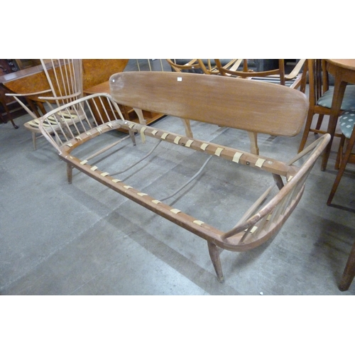 57 - An Ercol Blonde elm and beech 355 model studio couch/day bed