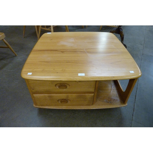 6 - An Ercol Blonde elm Pandora's Box coffee table