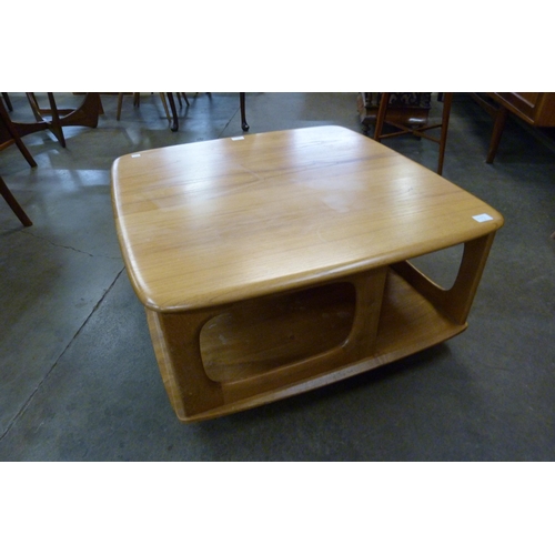 6 - An Ercol Blonde elm Pandora's Box coffee table