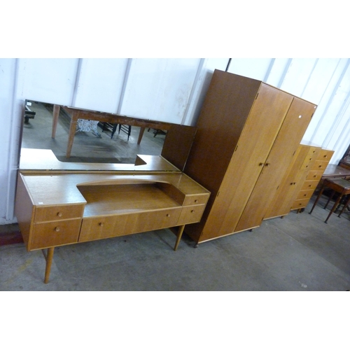 68 - A Meredew oak four piece bedroom suite, comprising; wardrobe, tallboy, dressing table and a chest of... 