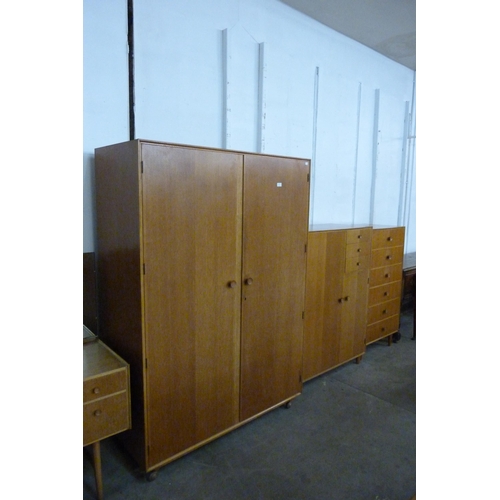 68 - A Meredew oak four piece bedroom suite, comprising; wardrobe, tallboy, dressing table and a chest of... 