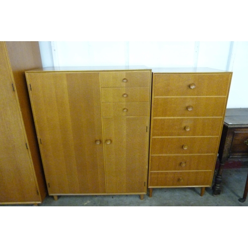 68 - A Meredew oak four piece bedroom suite, comprising; wardrobe, tallboy, dressing table and a chest of... 