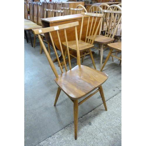 79 - A set of four Ercol Blonde elm and beech 391 model chairs