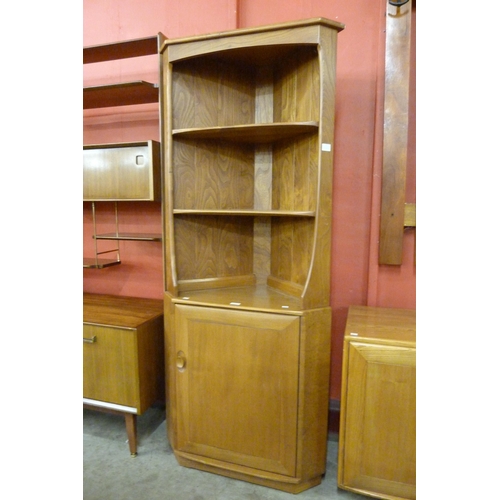 8 - An Ercol Blonde elm and beech freestanding corner cabinet