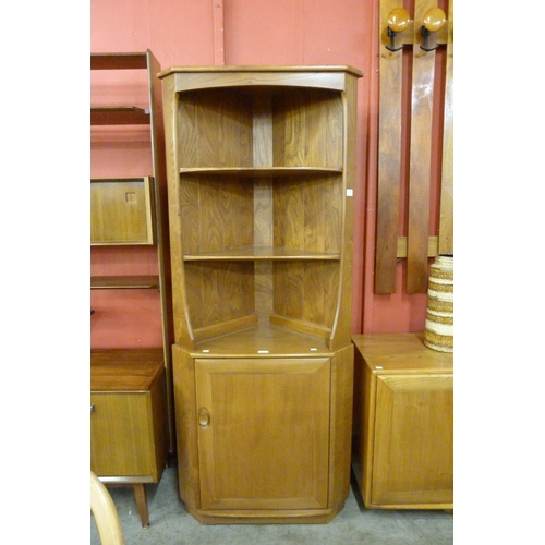 8 - An Ercol Blonde elm and beech freestanding corner cabinet