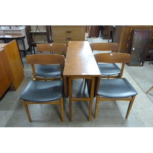 80 - A teak drop-leaf dining table and four chairs