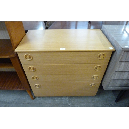 84 - A teak chest of drawers