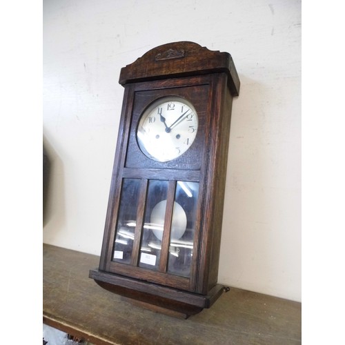 351 - An oak wall clock