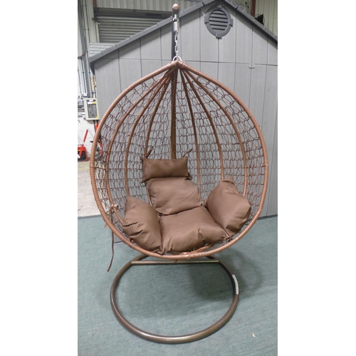 3043 - Swinging indoor/outdoor rattan and brown fabric egg chair  * This lot is subject to vat