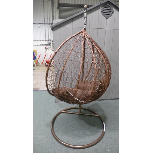 3043 - Swinging indoor/outdoor rattan and brown fabric egg chair  * This lot is subject to vat