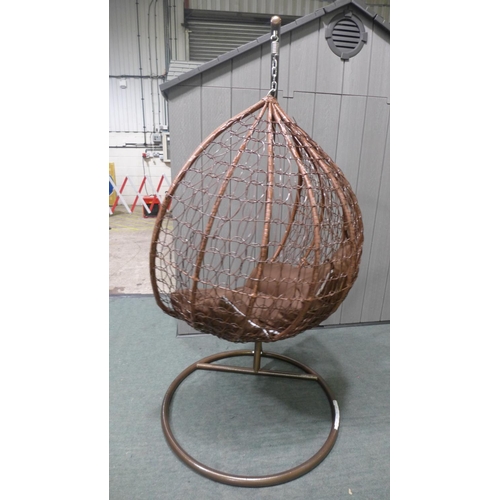 3044 - Swinging indoor/outdoor rattan and brown fabric egg chair   * This lot is subject to vat