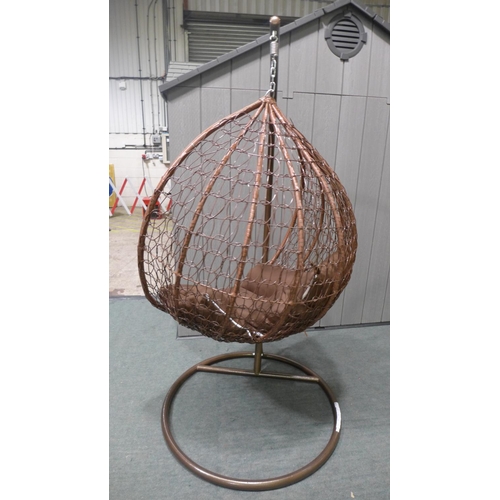 3045 - Swinging indoor/outdoor rattan and brown fabric egg chair   * This lot is subject to vat