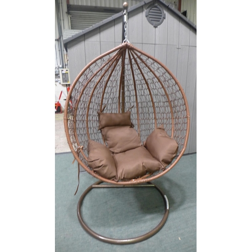 3046A - Swinging indoor/outdoor rattan and brown fabric egg chair   * This lot is subject to vat