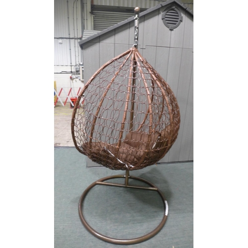 3046A - Swinging indoor/outdoor rattan and brown fabric egg chair   * This lot is subject to vat