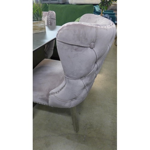 1301 - A grey ceramic top dining table with a set of six pink velvet dining chairs  *This lot is subject to... 