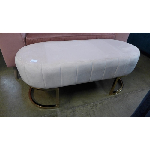 1330 - A pink upholstered footstool with gold legs