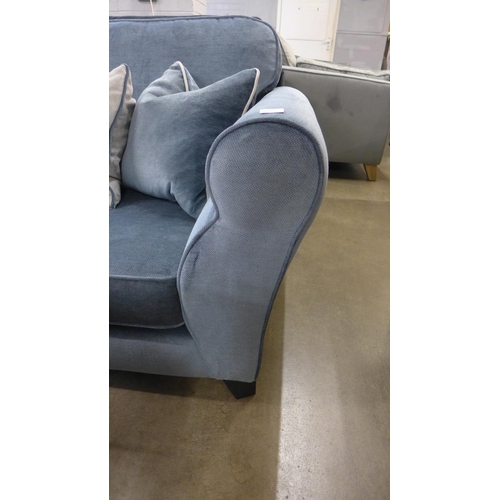 1378 - A diamond blue upholstered four seater sofa