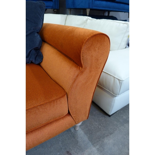 1451 - A burnt orange velvet and midnight blue three seater sofa