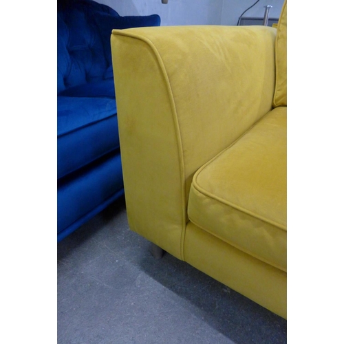 1503 - A pair of mustard yellow pinch back velvet love seats