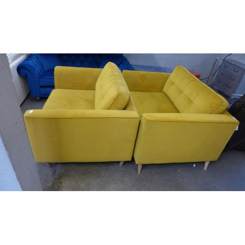 1503 - A pair of mustard yellow pinch back velvet love seats