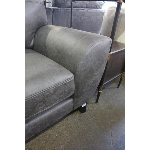 1466 - A grey vegan leather upholstered three seater sofa