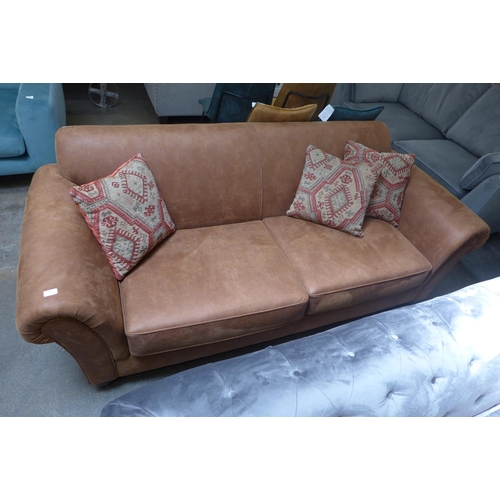 1485 - A tan vegan leather upholstered three seater sofa