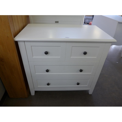 1487 - A white painted cot bed and chest of drawers * this lot is subject to VAT