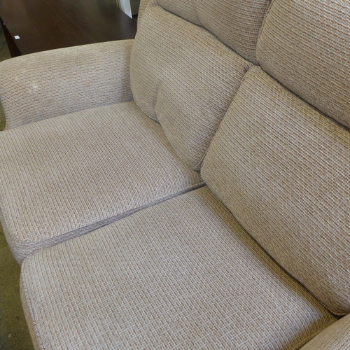 1579 - A pair of Parker Knoll, oatmeal, two seater sofas