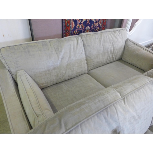 1587 - A pair of Barker And Stonehouse champagne three seater sofas - worn