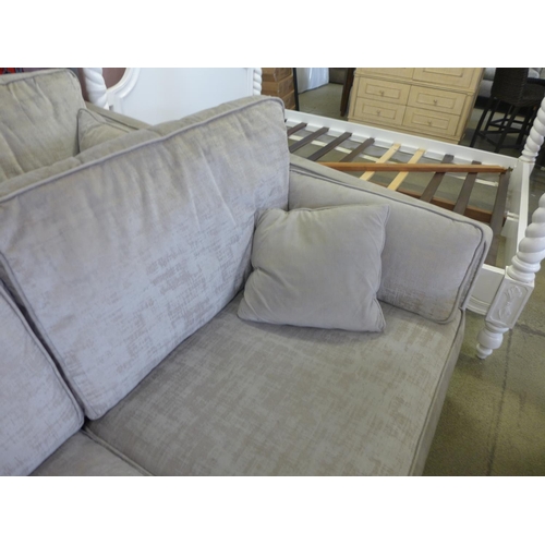 1587 - A pair of Barker And Stonehouse champagne three seater sofas - worn