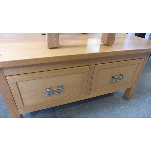 1594 - An oak two drawer coffee table and matching lamp table