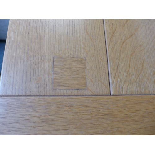 1594 - An oak two drawer coffee table and matching lamp table