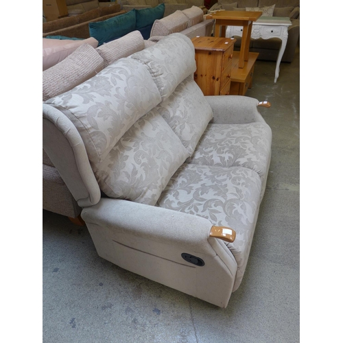 1602 - An olive green patterned two seater manual reclining sofa