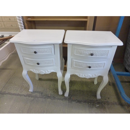 1607 - A pair of white French style bedside chests