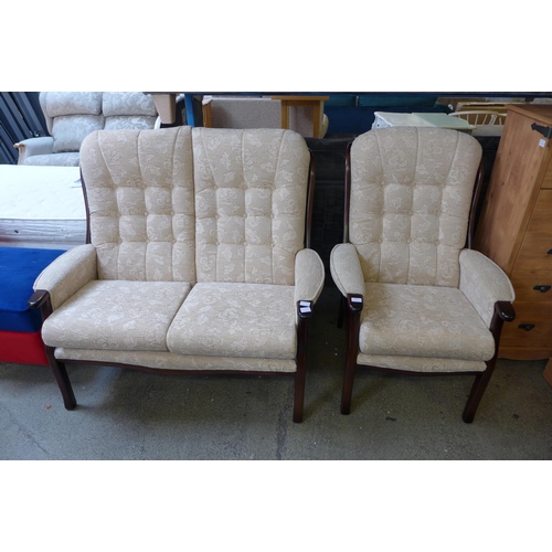 1611 - A dark stained wood and cream upholstered floral button back, two seater, high back, bench and armch... 