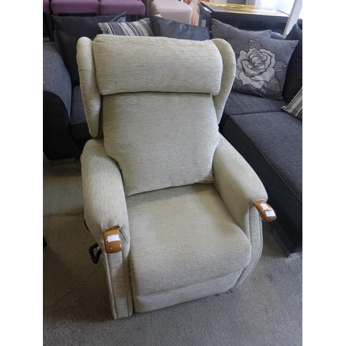 1618 - An olive green rise and recline armchair