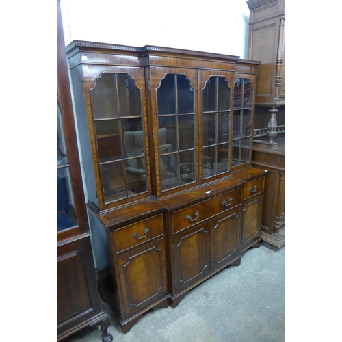 599 - A Regency style mahogany breakfront secretaire bookcase