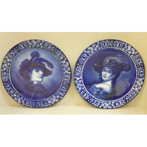 617 - A pair of Royal Blue Delft portrait plates, after Rembrandt, 32cm