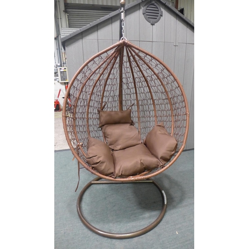 3038 - Swinging indoor/outdoor rattan and brown fabric egg chair   * This lot is subject to vat