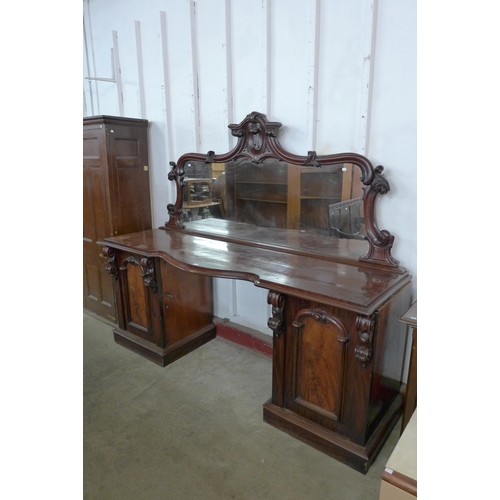 125 - A Victorian mahogany mirrorback pedestal sideboard