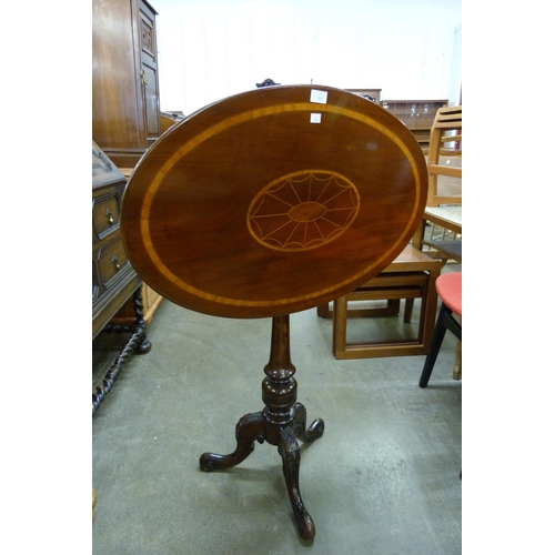 145 - A Victorian inlaid mahogany oval tilt-top tripod table