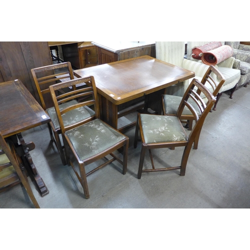 188 - A carved oak six piece dining suite