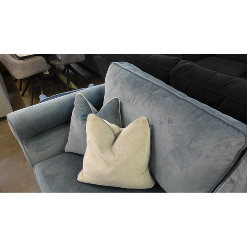 1378 - A diamond blue upholstered four seater sofa