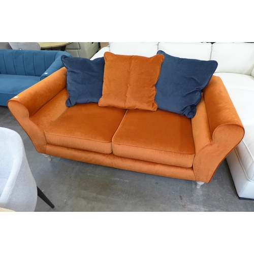 1451 - A burnt orange velvet and midnight blue three seater sofa