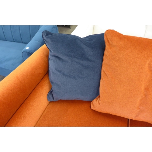 1451 - A burnt orange velvet and midnight blue three seater sofa