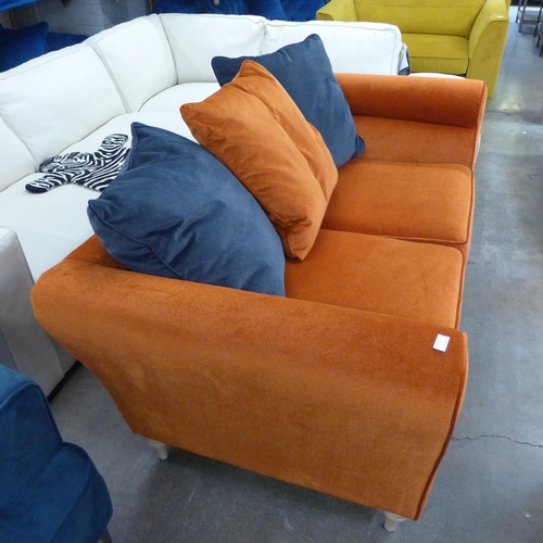 1451 - A burnt orange velvet and midnight blue three seater sofa