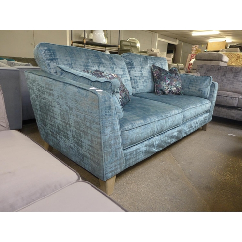 1460 - A Barker And Stonehouse teal velvet upholstered four seater sofa with patterned scatter cushions