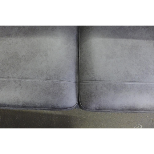 1466 - A grey vegan leather upholstered three seater sofa