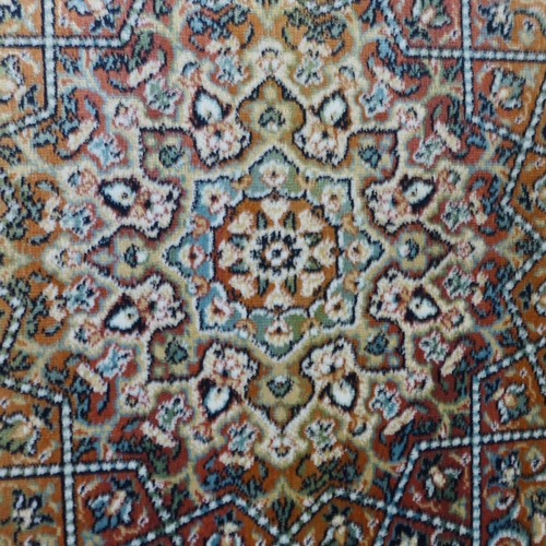 1533 - A blue ground Royal Palace rug, central medallion design 195cm x 135cm